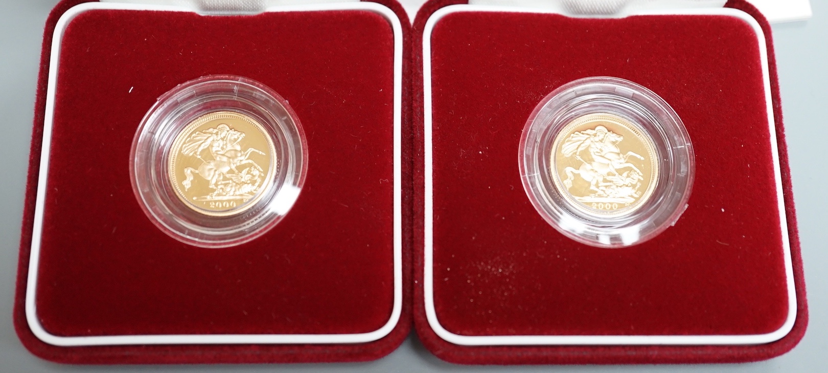 Two cased gold proof half sovereigns, 2000.